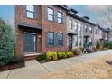 Row of townhouses with brick exteriors and gray shutters at 100 Linestowe Dr, Belmont, NC 28012