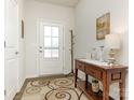 Bright entryway with coat rack, console table, and decorative rug at 1417 Turkey Roost Rd # 69, Fort Mill, SC 29715