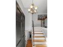 Inviting entryway with staircase and chandelier at 261 Skyline Rd, Hickory, NC 28601