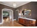 Bright entryway with hardwood floors, stylish console table, and view to living room at 342 Wendover Hill Ct, Charlotte, NC 28211