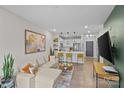 Open concept living room with sectional sofa, large TV, and stylish decor at 3630 N Davidson St # 2210, Charlotte, NC 28205