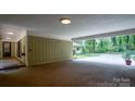 Covered carport with access to backyard, providing convenient parking at 825 W Ketchie St, China Grove, NC 28023