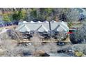Aerial view showcasing a condo building near a lake at 921 Northeast Dr, Davidson, NC 28036