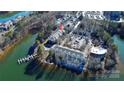 Aerial view of lakefront property with condo building and parking at 921 Northeast Dr, Davidson, NC 28036