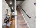 Modern staircase with dark wood railing leading to the upper level at 9408 Hamel St, Charlotte, NC 28215