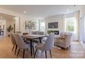 Open dining area with a modern table and six chairs at 1408 Camp Greene St, Charlotte, NC 28208