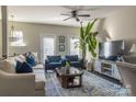 Spacious living area with comfy seating and large TV at 15044 New Amsterdam Ln, Charlotte, NC 28204