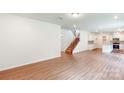 Spacious living room with hardwood floors and an open staircase at 248 Winford Rd, Troutman, NC 28166