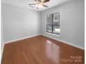 Bright bedroom with hardwood floors and large window at 3214 Noda Blvd, Charlotte, NC 28205