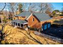 Brick home with large deck, attached garage, and fenced yard at 3467 Rock Bridge Dr, Conover, NC 28613