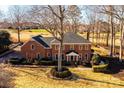 Two-story brick home with mature trees and circular driveway at 3467 Rock Bridge Dr, Conover, NC 28613