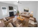 Virtually staged living room with fireplace and hardwood floors at 415 Delta Dr, Fort Mill, SC 29715