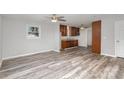 Open living room with new flooring and ceiling fan at 504 E Poplar St, Dallas, NC 28034