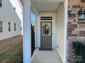 Inviting front entry with a brown door and sidelights, leading to the home's interior at 5626 De Vere Dr, Indian Land, SC 29707
