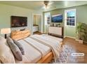 Virtually staged main bedroom with light walls, hardwood floors and en-suite bathroom at 8003 Regent Park Ln, Charlotte, NC 28210