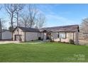 Brick ranch home with attached garage and landscaped yard at 8260 Blades Trl, Denver, NC 28037