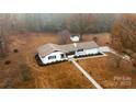 Aerial view of a ranch home, detached shed, and large lot at 111 Oakmont Rd, Stanley, NC 28164