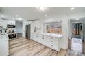 Bright kitchen features white shaker cabinets, quartz countertops, and stainless steel appliances at 111 Oakmont Rd, Stanley, NC 28164