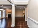 Open living space with hardwood floors and a fireplace at 203 Pine Needles Ln, Fort Mill, SC 29708