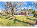 Brick ranch home with a detached shed and yard at 3607 Hickory Hwy, Statesville, NC 28677