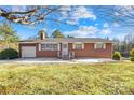 Brick ranch home with a spacious lawn at 3607 Hickory Hwy, Statesville, NC 28677