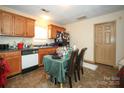 Functional kitchen with light-colored cabinets and appliances, adjacent to a dining area at 524 S Spruce St, Rock Hill, SC 29730