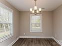 Dining room featuring hardwood floors and a chandelier at 571 Westside Cir, China Grove, NC 28023