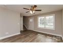 Bright living room with hardwood floors and neutral walls at 571 Westside Cir, China Grove, NC 28023