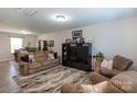 Open living space with large sectional sofa and adjacent dining area at 6307 Pennacook Dr, Charlotte, NC 28214