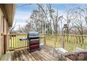 Wooden deck with grill and seating area, overlooking yard at 6520 Weldon Nw Cir, Concord, NC 28027