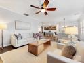 Open living area with a neutral color palette, hardwood floors, and comfortable seating at 1000 Lily Pond Cir, Waxhaw, NC 28173