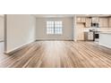 A spacious living room area with luxury vinyl plank flooring and abundant natural light at 1187 Blackburn Cir, Edgemoor, SC 29712