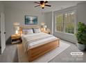 Bright bedroom with a large window and light wood furniture at 12064 Spinnaker Dr, Fort Mill, SC 29708