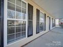 Front porch view of house with black shutters and a front door at 156 Elrosa Rd, Mooresville, NC 28115