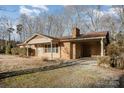 Brick ranch home with attached carport at 2214 Munsen Rd, Concord, NC 28025