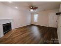 Living room with fireplace and wood-look floors at 2240 15Th Ne Ave # 105, Hickory, NC 28601