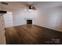 Living room with fireplace and wood-look floors at 2240 15Th Ne Ave # 105, Hickory, NC 28601