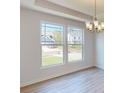 Dining room with large windows and hardwood floors at 242 Winford Rd, Troutman, NC 28116