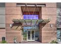 Brick building with glass canopy entrance at 315 Arlington Ave # 2201, Charlotte, NC 28203