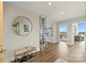 Bright entryway with wine storage and access to balcony at 315 Arlington Ave # 2201, Charlotte, NC 28203