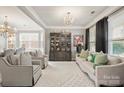 Bright living room with comfy seating, large windows, and a statement rug at 3332 Delaware Dr, Denver, NC 28037