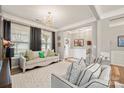 Living room with light-colored sofa, two armchairs, and a large rug at 3332 Delaware Dr, Denver, NC 28037