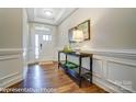 Bright entryway with hardwood floors and console table at 4005 Grace Pointe Dr # 100, Wesley Chapel, NC 28079