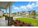 A welcoming neighborhood street view showcases meticulously maintained lawns and stylish homes at 4005 Grace Pointe Dr # 100, Wesley Chapel, NC 28079