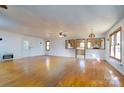 Hardwood floor living room with kitchen passthrough at 41943 Gurley Rd, New London, NC 28127