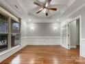 Bright living room with hardwood floors and a view to the backyard at 5124 Craftsman Ridge Dr, Matthews, NC 28104