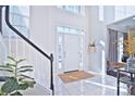 Bright and spacious entryway with tiled floors and staircase at 5921 Marshbank Ln, Charlotte, NC 28269