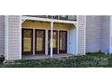 Condo patio with three dark brown sliding glass doors at 6127 Meadow Rose Ln, Charlotte, NC 28215