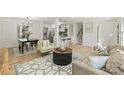 Bright dining area with hardwood floors and modern chandelier at 6706 Queensberry Dr, Charlotte, NC 28226