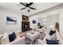 Living room with a brick fireplace and comfy seating at 6762 Glenmoor Dr, Charlotte, NC 28214